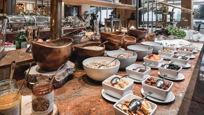 Buffet with various cereals and dried fruits in a restaurant