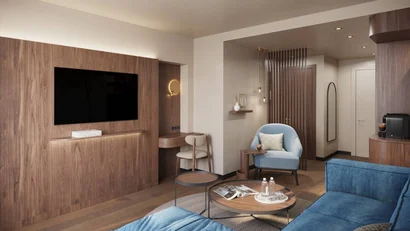 Modern living room with blue chairs, wooden wall and wall-mounted TV