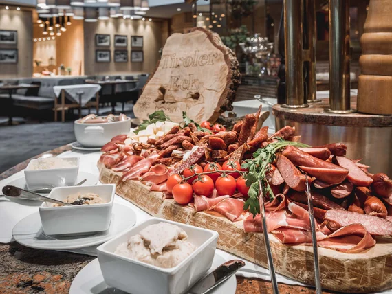 Buffet with assorted sausages and cheeses in elegant restaurant