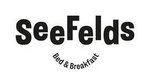 SeaFelds logo in black on white with text Ocean, Sleep & Breakfast