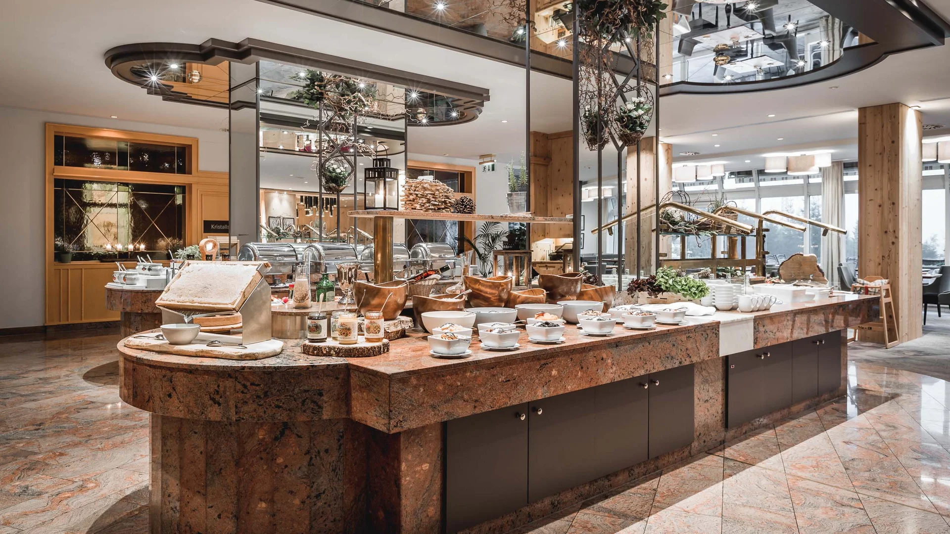 Modern buffet with warm lighting and mirrors in a restaurant