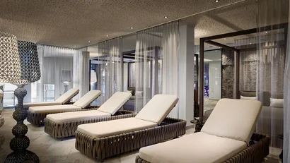 Relax area with loungers and modern lamps in a spa
