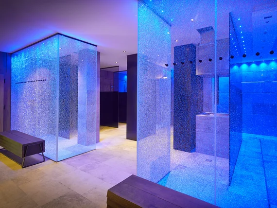 Modern wellness area with blue lighting and benches