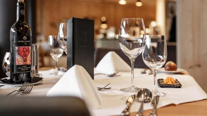 Elegant set table with wine bottle in a restaurant